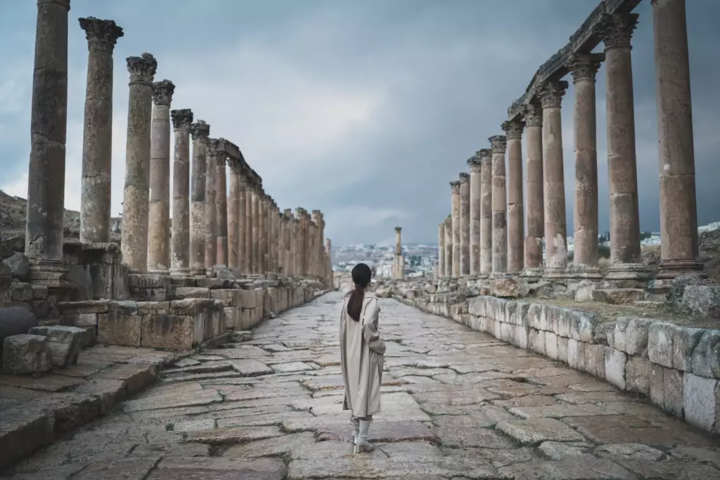 Jerash colonnaded street A visitor walking along the colonnaded stone street at Jerash